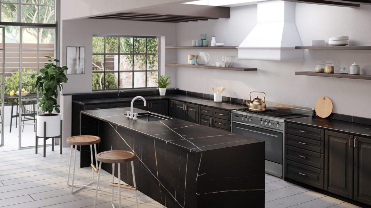 A modern kitchen with black stone worktops