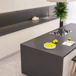 A kitchen with a dark grey quartz worktop