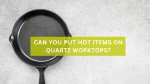 A worktop with a frying pan with text over it saying 'Can You Put Hot Items on Quartz Worktops'