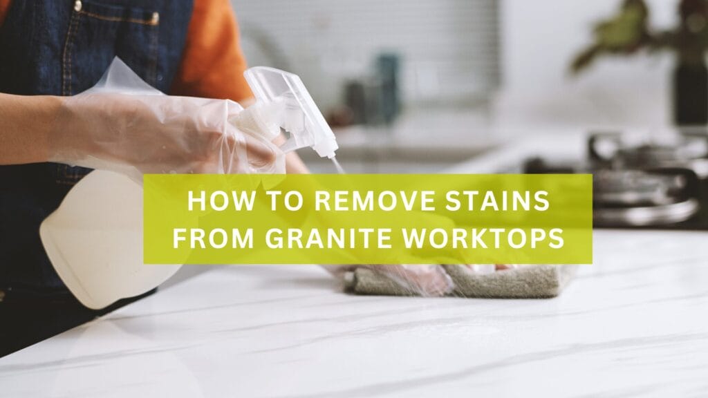 A person removing a stain from a granite worktop
