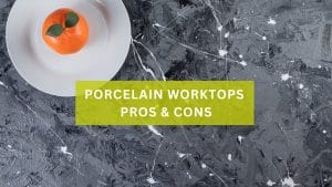 Grey porcelain worktop with fruit decor and text over the image with 'Porcelain Worktops Pros & Cons'